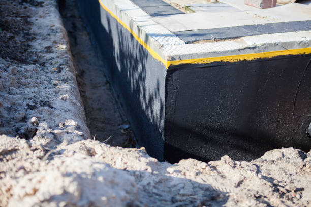 Professional Waterproofing technician working in Rossville, GA